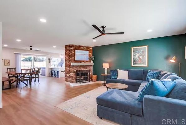 Dining room, Fireplace, Interior, Living room, Recessed Lighting, Stone Walls, Wood Texture Flooring