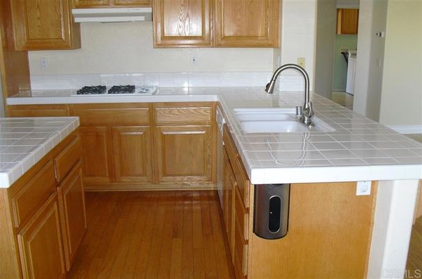 Interior, Kitchen, Tile Countertops, Wood Texture Flooring