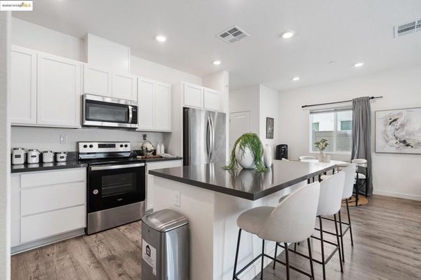Dining room, Interior, Kitchen, Recessed Lighting, Stainless Steel Appliances, Wood Texture Flooring