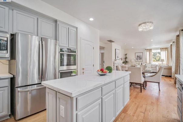 Dining room, Interior, Kitchen, Living room, Recessed Lighting, Stainless Steel Appliances, Wood Texture Flooring