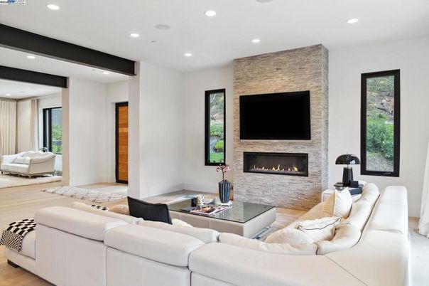 Fireplace, Interior, Living room, Recessed Lighting, Stone Walls, Wood Texture Flooring