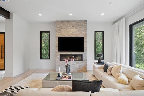 Fireplace, Interior, Living room, Recessed Lighting, Stone Walls, Wood Texture Flooring