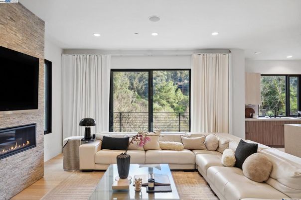 Fireplace, Interior, Living room, Recessed Lighting, Stone Walls, Wood Texture Flooring