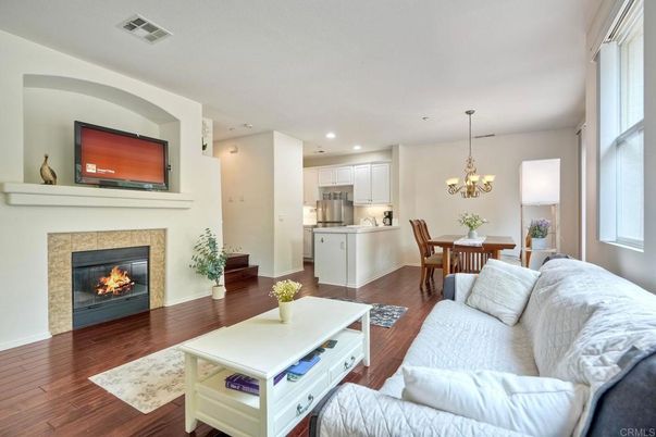 Chandelier, Dining room, Fireplace, Interior, Kitchen, Living room, Recessed Lighting, Wood Texture Flooring