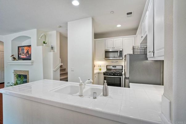 Interior, Kitchen, Recessed Lighting, Stainless Steel Appliances, Tile Countertops