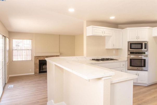 Fireplace, Interior, Kitchen, Recessed Lighting, Wood Texture Flooring