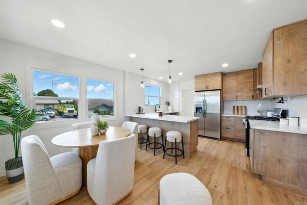 Dining room, Interior, Kitchen, Pendant Lights, Recessed Lighting, Stainless Steel Appliances, Water, Wood Texture Flooring