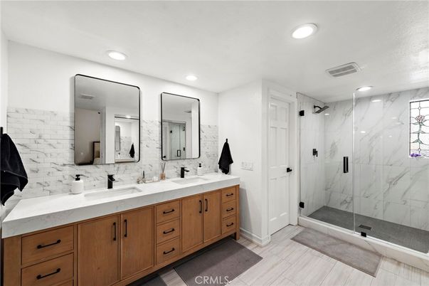 Bathroom, Dual Sink Vanities, Glass Shower, Interior, Marble Walls, Recessed Lighting