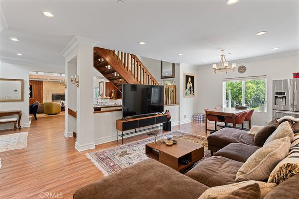 Chandelier, Dining room, Fireplace, Interior, Living room, Pendant Lights, Recessed Lighting, Wood Texture Flooring