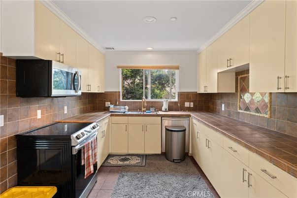 Interior, Kitchen, Recessed Lighting, Stainless Steel Appliances, Tile Countertops
