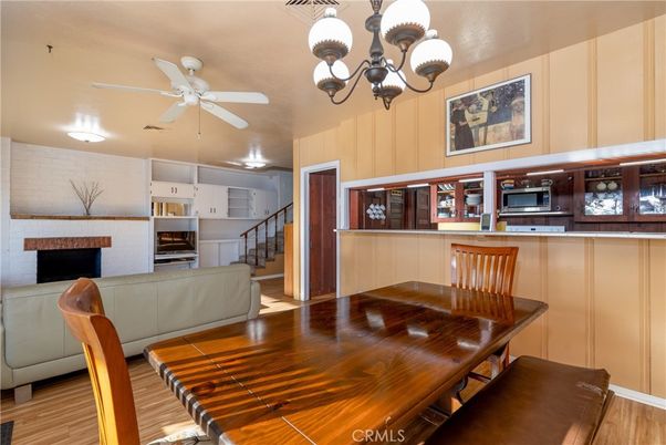 Chandelier, Dining room, Fireplace, Interior, Kitchen, Wood Texture Flooring