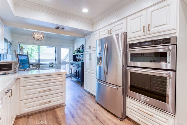 Chandelier, Interior, Kitchen, Recessed Lighting, Stainless Steel Appliances, Wood Texture Flooring