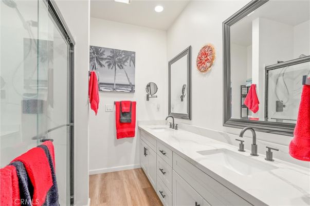 Bathroom, Dual Sink Vanities, Glass Shower, Interior, Recessed Lighting, Wood Texture Flooring