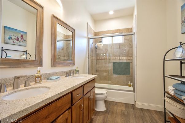 Bathroom, Dual Sink Vanities, Glass Shower, Interior, Recessed Lighting, Wood Texture Flooring