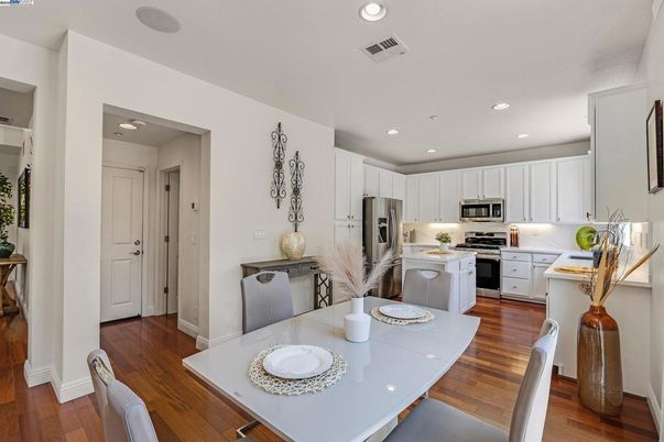 Dining room, Interior, Kitchen, Recessed Lighting, Stainless Steel Appliances, Wood Texture Flooring