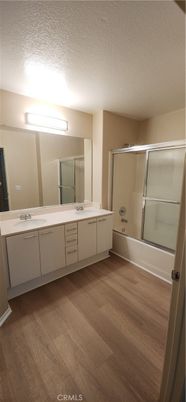 Bathroom, Dual Sink Vanities, Glass Shower, Interior, Wood Texture Flooring