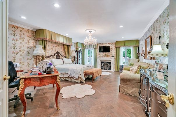 Bedroom, Chandelier, Fireplace, Interior, Recessed Lighting, Wood Texture Flooring