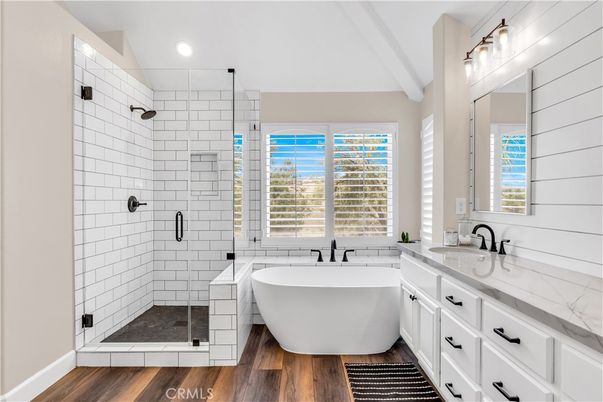 Bathroom, Dual Sink Vanities, Free Standing Baths, Glass Shower, Interior, Recessed Lighting, Wood Texture Flooring