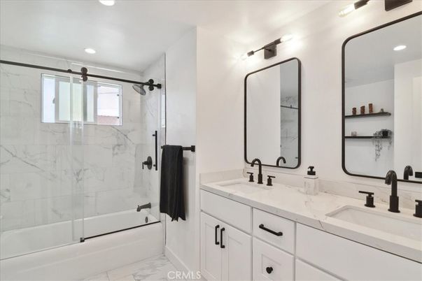 Bathroom, Dual Sink Vanities, Glass Shower, Interior, Marble, Marble Walls, Recessed Lighting