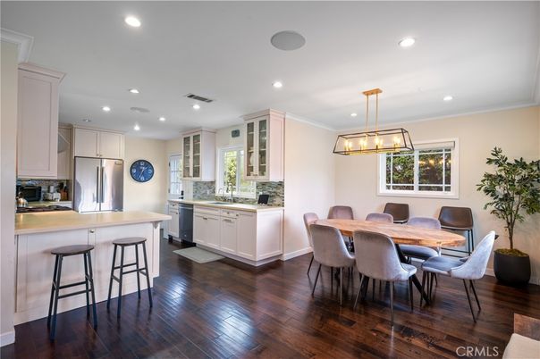 Dining room, Interior, Kitchen, Pendant Lights, Recessed Lighting, Stainless Steel Appliances, Wood Texture Flooring