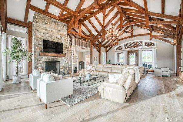 Chandelier, Fireplace, Interior, Living room, Stone Walls, Wooden Beams, Wood Texture Flooring