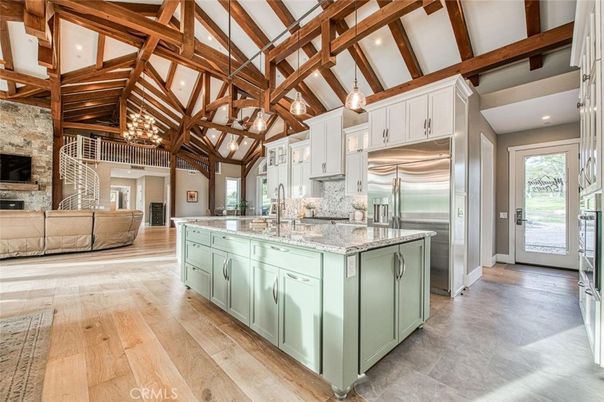Fireplace, Interior, Kitchen, Living room, Pendant Lights, Recessed Lighting, Stainless Steel Appliances, Stone Walls, Wooden Beams, Wood Texture Flooring