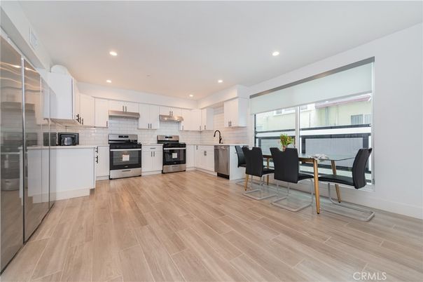 Dining room, Interior, Kitchen, Recessed Lighting, Stainless Steel Appliances, Wood Texture Flooring