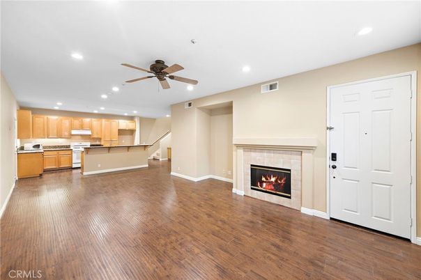 Empty room, Fireplace, Interior, Kitchen, Recessed Lighting, Wood Texture Flooring