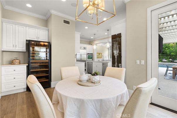Dining room, Interior, Kitchen, Pendant Lights, Recessed Lighting, Stainless Steel Appliances, Wood Texture Flooring