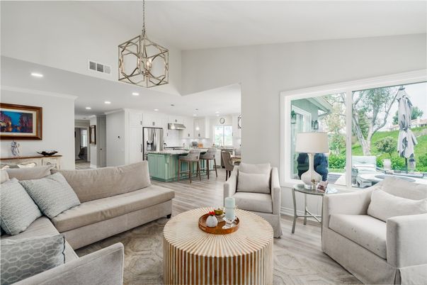 Chandelier, Interior, Kitchen, Living room, Pendant Lights, Recessed Lighting, Stainless Steel Appliances, Wood Texture Flooring