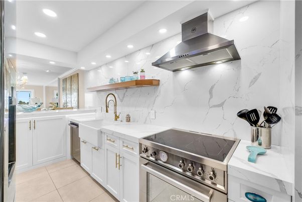 Interior, Kitchen, Marble Walls, Recessed Lighting, Stainless Steel Appliances