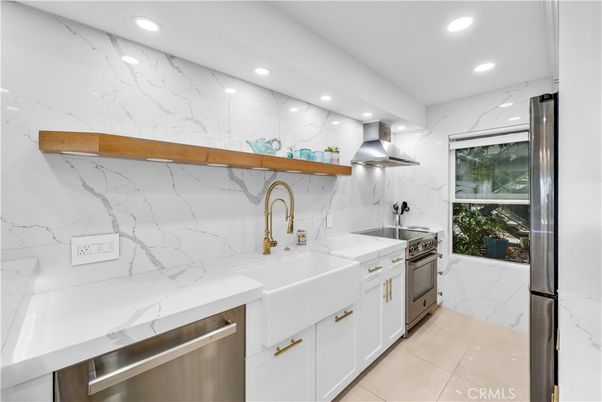 Interior, Kitchen, Marble Walls, Recessed Lighting, Stainless Steel Appliances