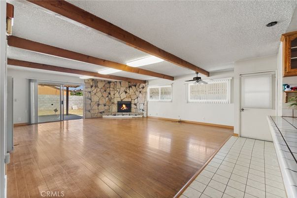Empty room, Fireplace, Interior, Stone Walls, Wooden Beams, Wood Texture Flooring