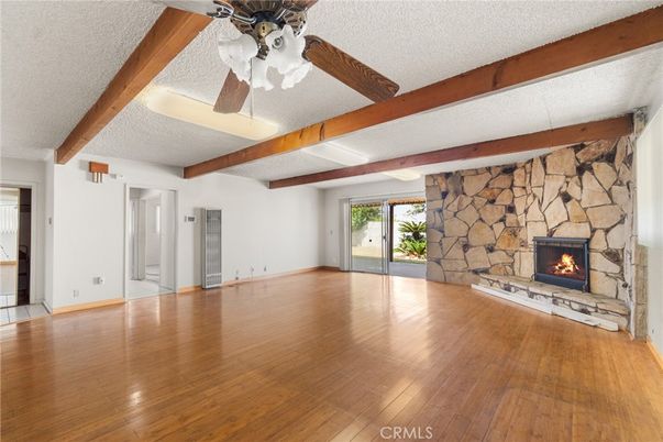 Empty room, Fireplace, Interior, Stone Walls, Wooden Beams, Wood Texture Flooring