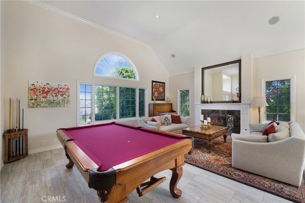 Billiard Table, Fireplace, Game Room, Interior, Living room, Recessed Lighting, Wood Texture Flooring