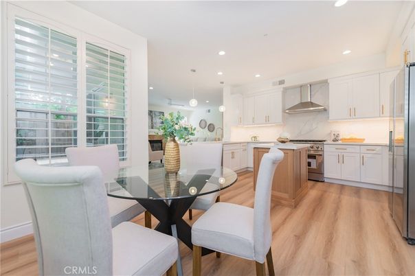 Dining room, Interior, Kitchen, Pendant Lights, Recessed Lighting, Stainless Steel Appliances, Wood Texture Flooring