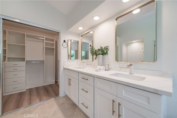 Bathroom, Dual Sink Vanities, Interior, Recessed Lighting, Walk-in Closets, Wood Texture Flooring
