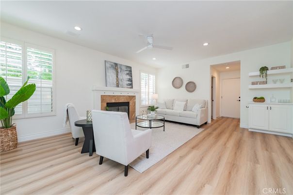 Dining room, Fireplace, Interior, Living room, Recessed Lighting, Wood Texture Flooring