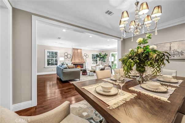 Chandelier, Dining room, Fireplace, Interior, Living room, Recessed Lighting, Wood Texture Flooring