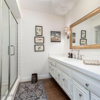 Bathroom, Dual Sink Vanities, Glass Shower, Interior, Tile Countertops, Wood Texture Flooring