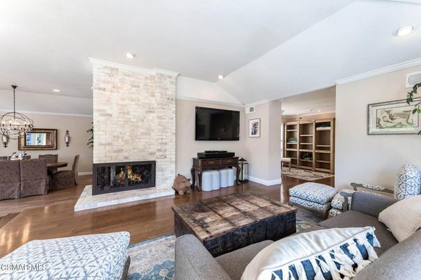 Chandelier, Dining room, Fireplace, Interior, Living room, Recessed Lighting, Stone Walls, Wood Texture Flooring