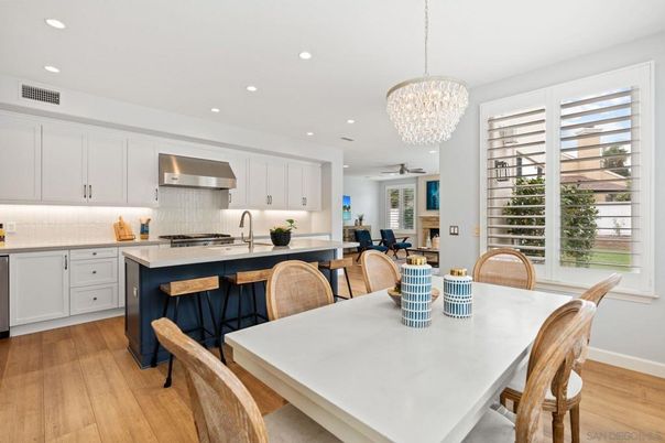 Chandelier, Dining room, Interior, Kitchen, Recessed Lighting, Stainless Steel Appliances, Wood Texture Flooring