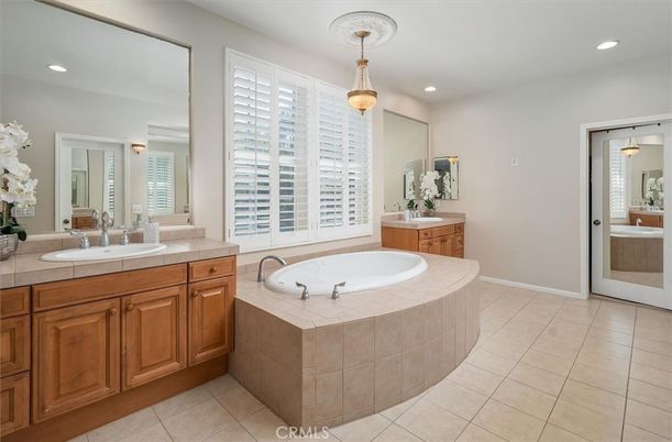 Bathroom, Dual Sink Vanities, Interior, Pendant Lights, Recessed Lighting, Tile Countertops
