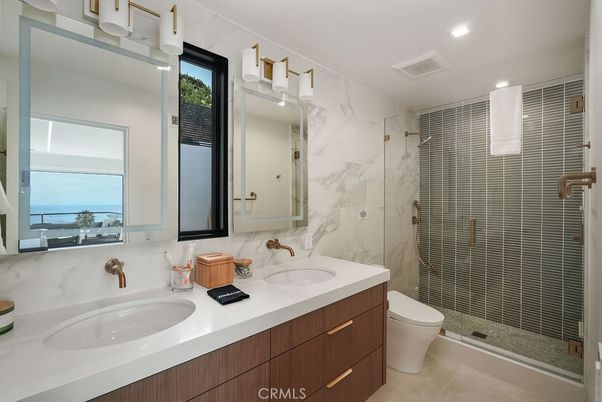 Bathroom, Dual Sink Vanities, Glass Shower, Interior, Marble Walls, Recessed Lighting, Water
