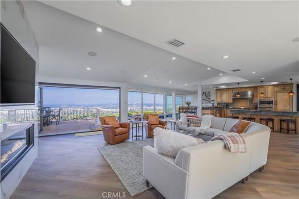 Dining room, Fireplace, Interior, Kitchen, Living room, Pendant Lights, Recessed Lighting, Stainless Steel Appliances, Wood Texture Flooring