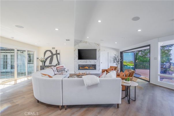 Fireplace, Interior, Living room, Marble Walls, Recessed Lighting, Wood Texture Flooring
