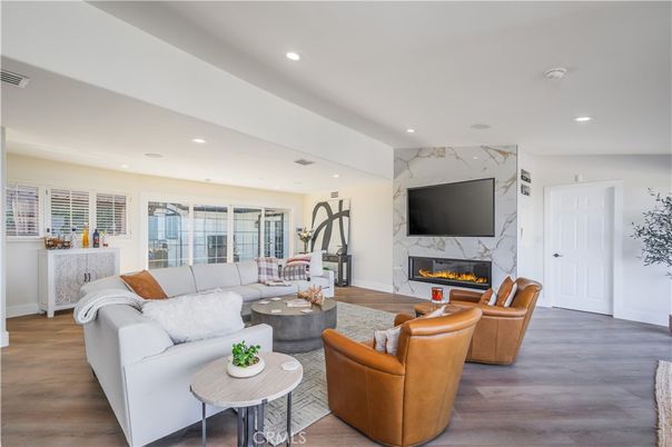 Fireplace, Interior, Living room, Marble Walls, Recessed Lighting, Wood Texture Flooring