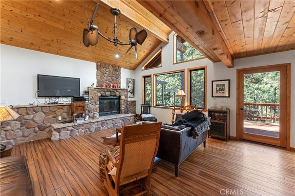 Dining room, Fireplace, Interior, Living room, Recessed Lighting, Stone Walls, Wooden Beams, Wooden Ceilings, Wood Texture Flooring