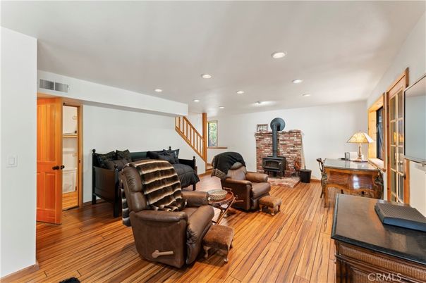 Fireplace, Interior, Living room, Recessed Lighting, Stone Walls, Wood Texture Flooring