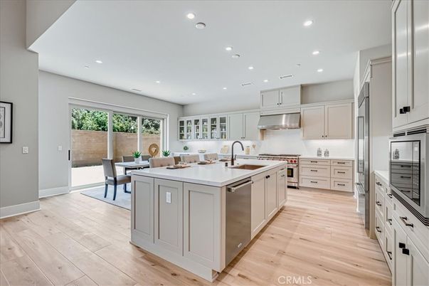 Dining room, Interior, Kitchen, Recessed Lighting, Stainless Steel Appliances, Wood Texture Flooring